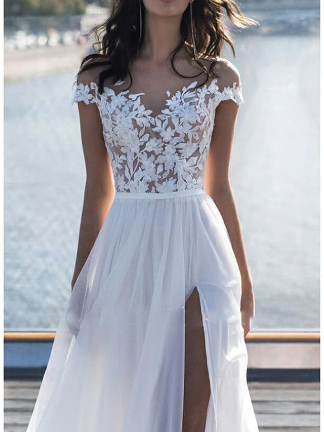 Close-up of lace detail on off-shoulder wedding dress sleeve.