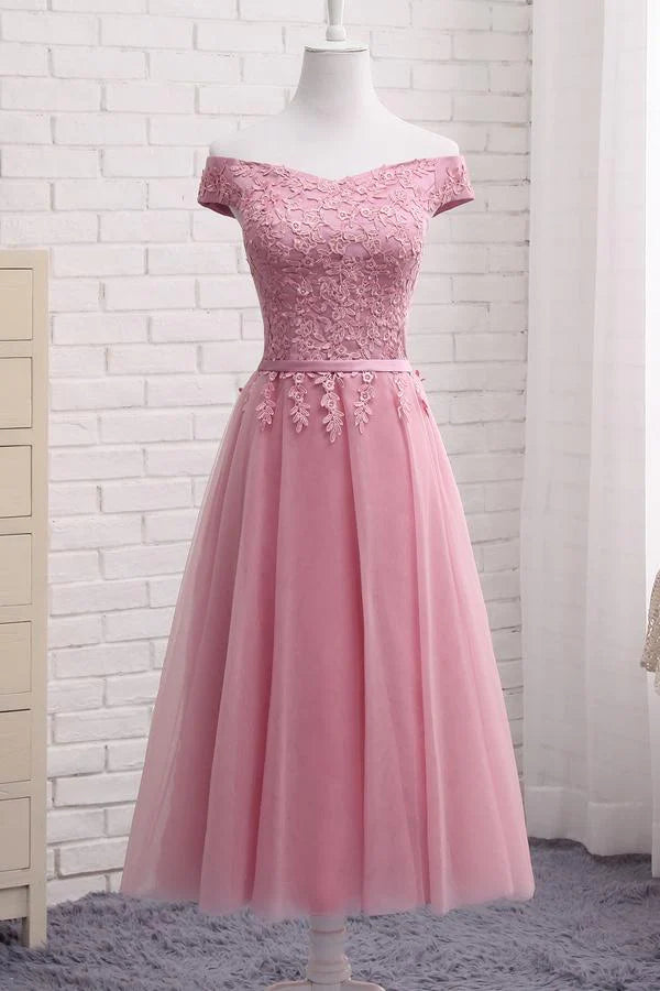 Model wearing a short A-line off-shoulder lace prom dress.