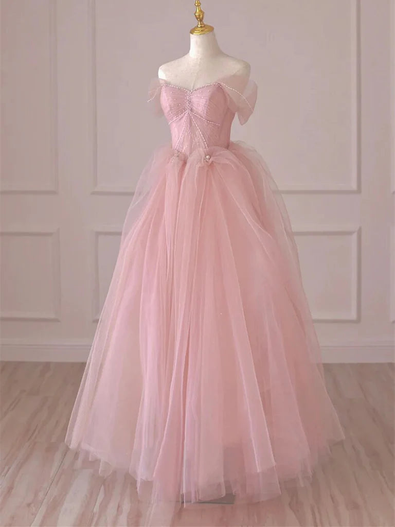 Model wearing an elegant off-shoulder lace and tulle long prom dress.