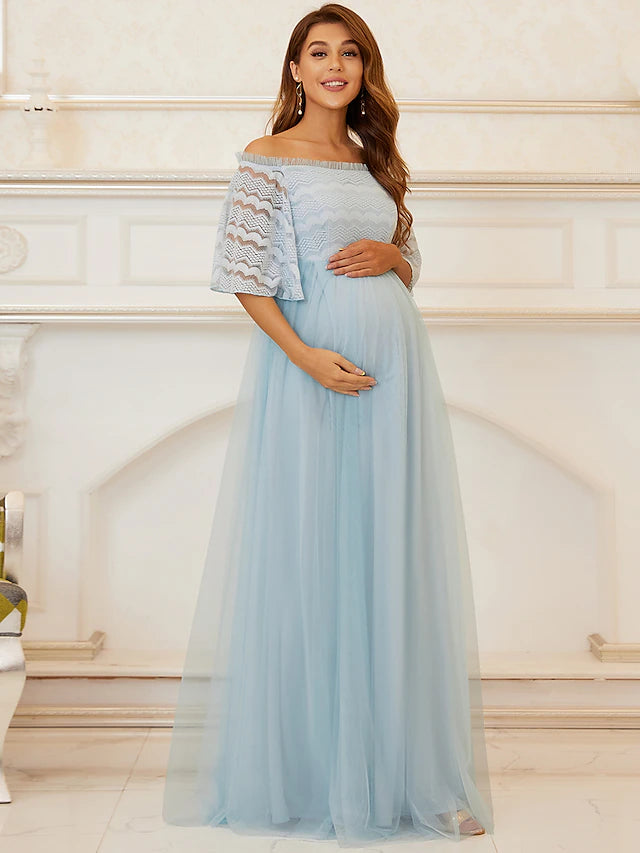 Elegant A-line off-shoulder lace tulle tiered gown.