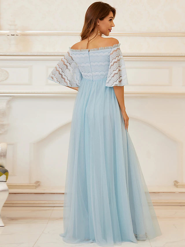 Detail of the tiered lace and tulle fabric on the gown's skirt.
