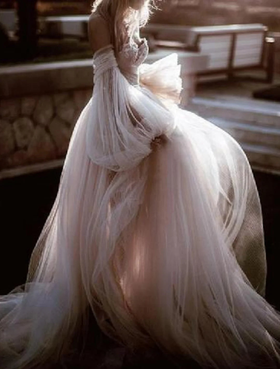 Front view of an elegant A-Line off-shoulder lace wedding dress.