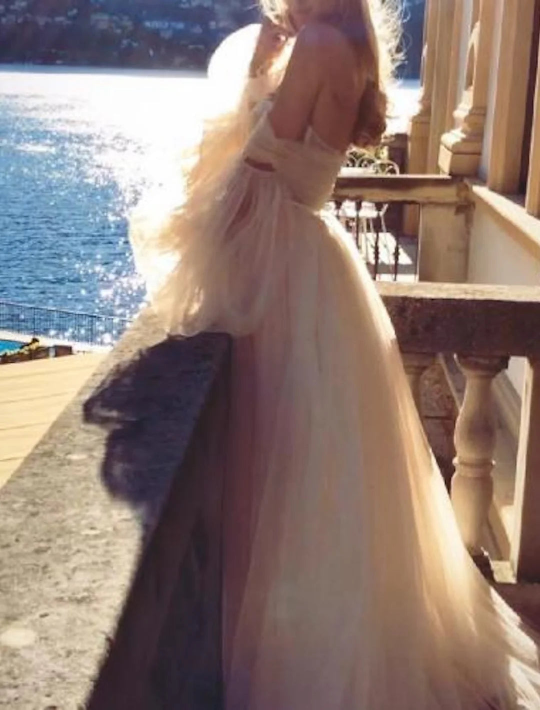 Close-up of the lace detail on an A-Line off-shoulder wedding dress.