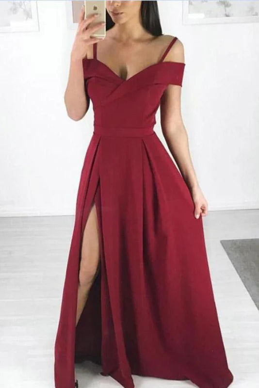 Woman wearing an elegant off-shoulder A-line long prom dress.