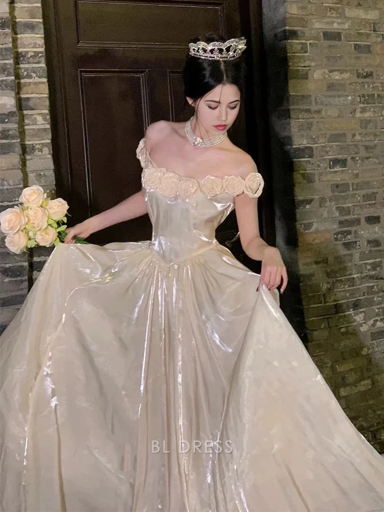 Side view of an A-line off-shoulder long navy dress, showcasing its flowing silhouette.