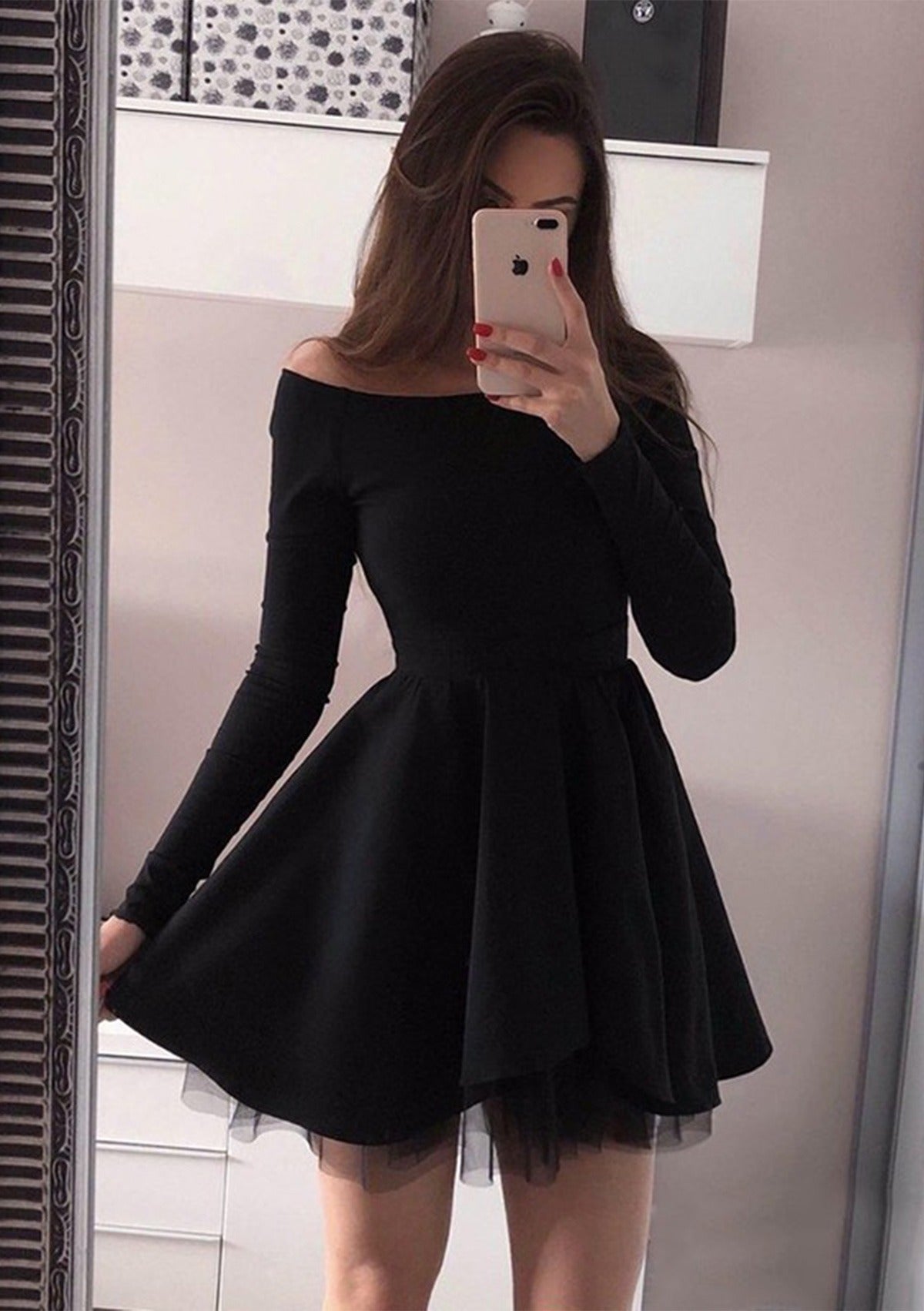 Black off-the-shoulder A-line short dress with long sleeves.