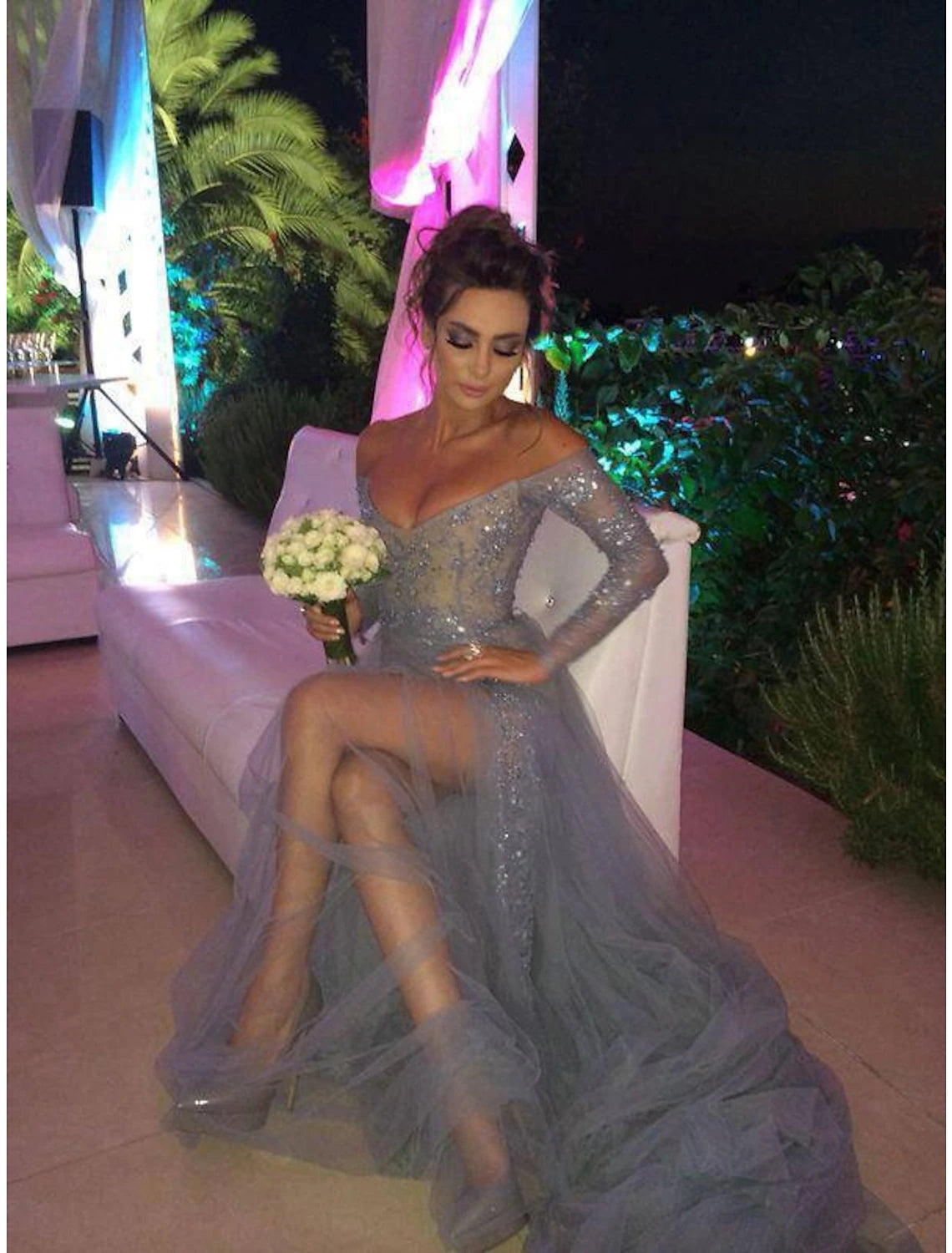 Side view of the A-line off-shoulder long sleeve chiffon dress, showcasing the sweep train.