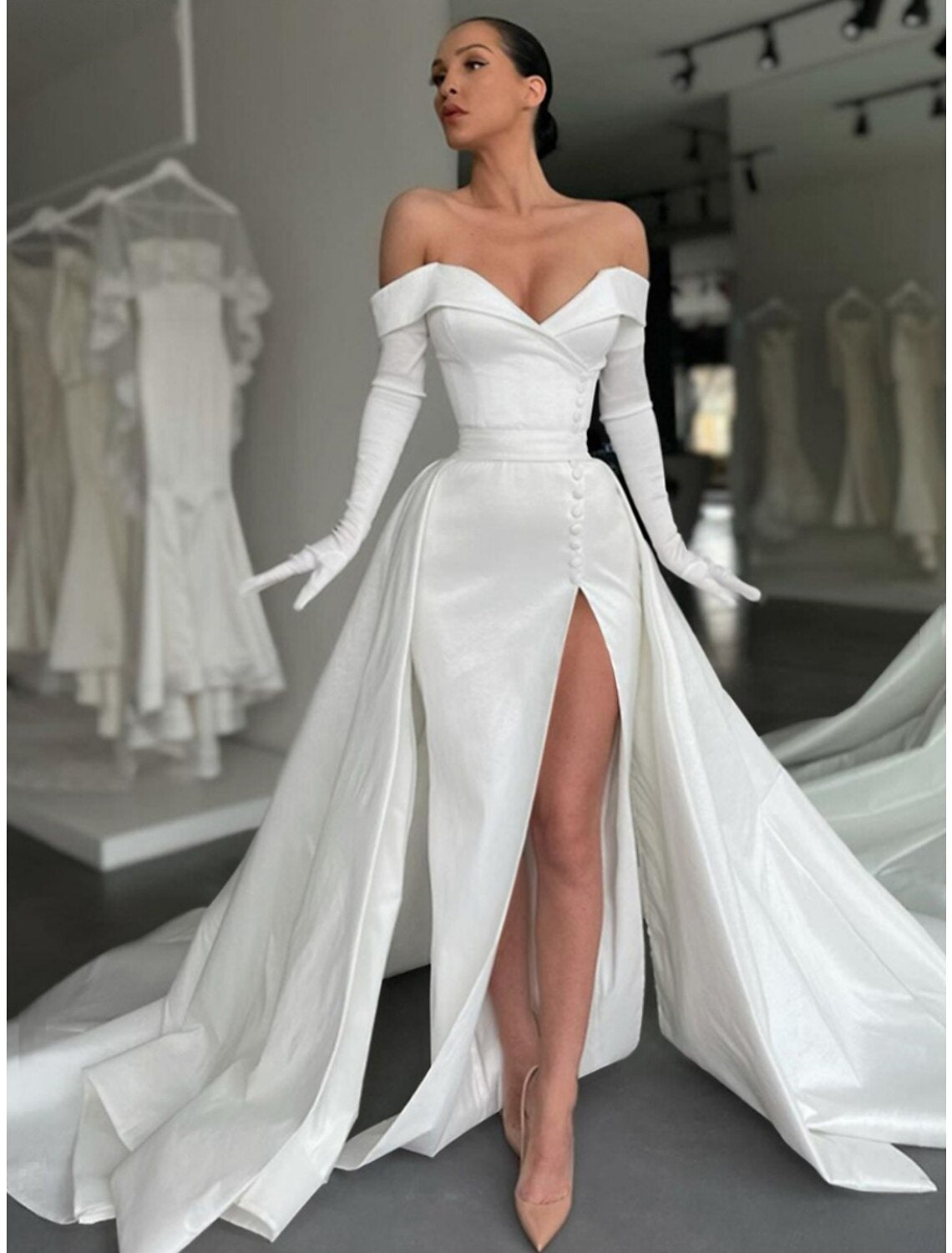 Back view of A-Line satin formal dress showing buttons and court train.