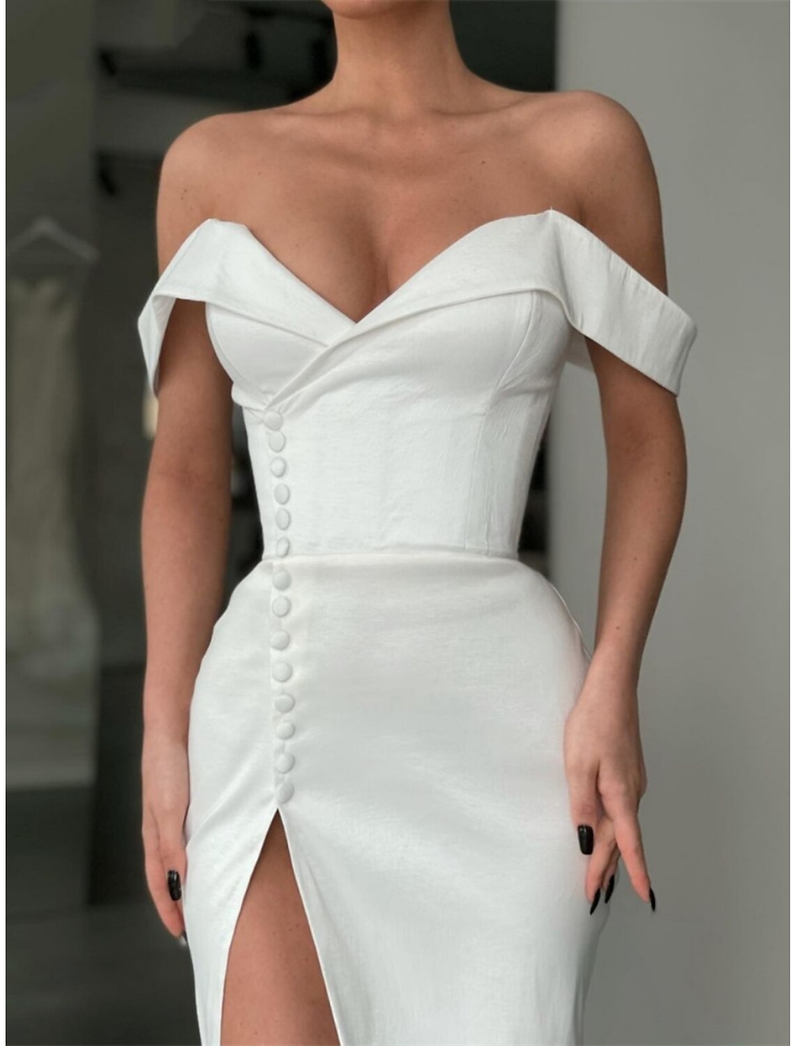 Full length view of the A-Line gown with pleats and flowing court train.