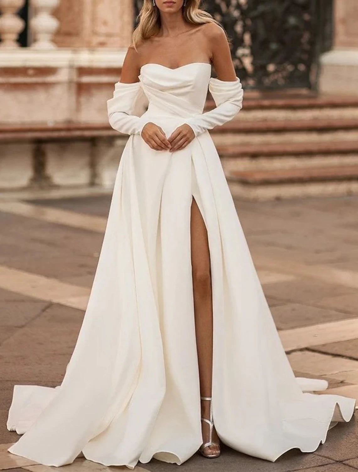 Back view of A-Line Off Shoulder Long Sleeve Satin Wedding Gown with Court Train.