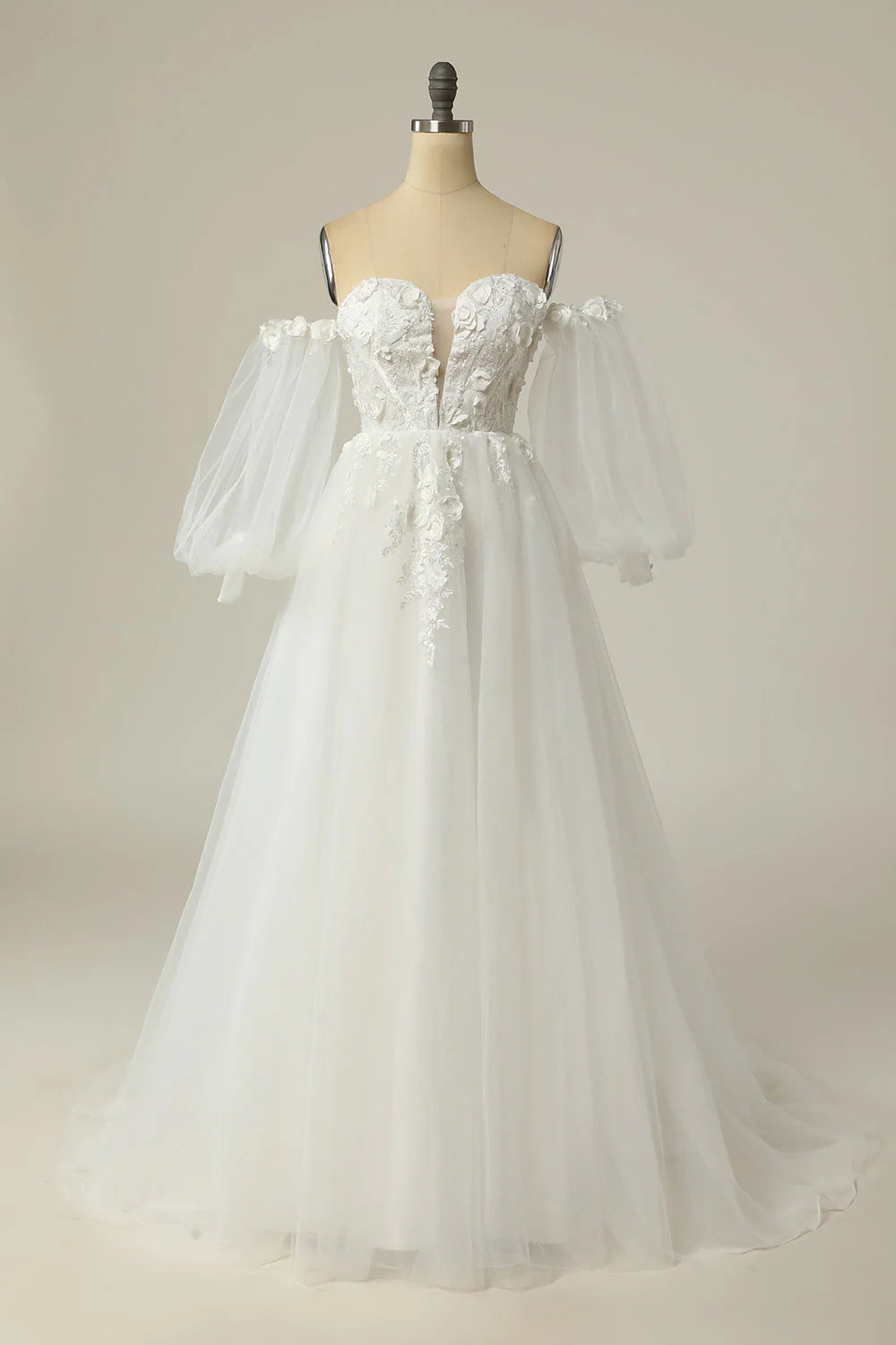 Elegant A-line off-the-shoulder wedding dress with long sleeves.