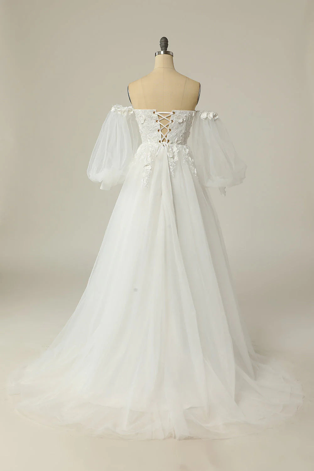 Back view of A-line bridal gown with long sleeves.