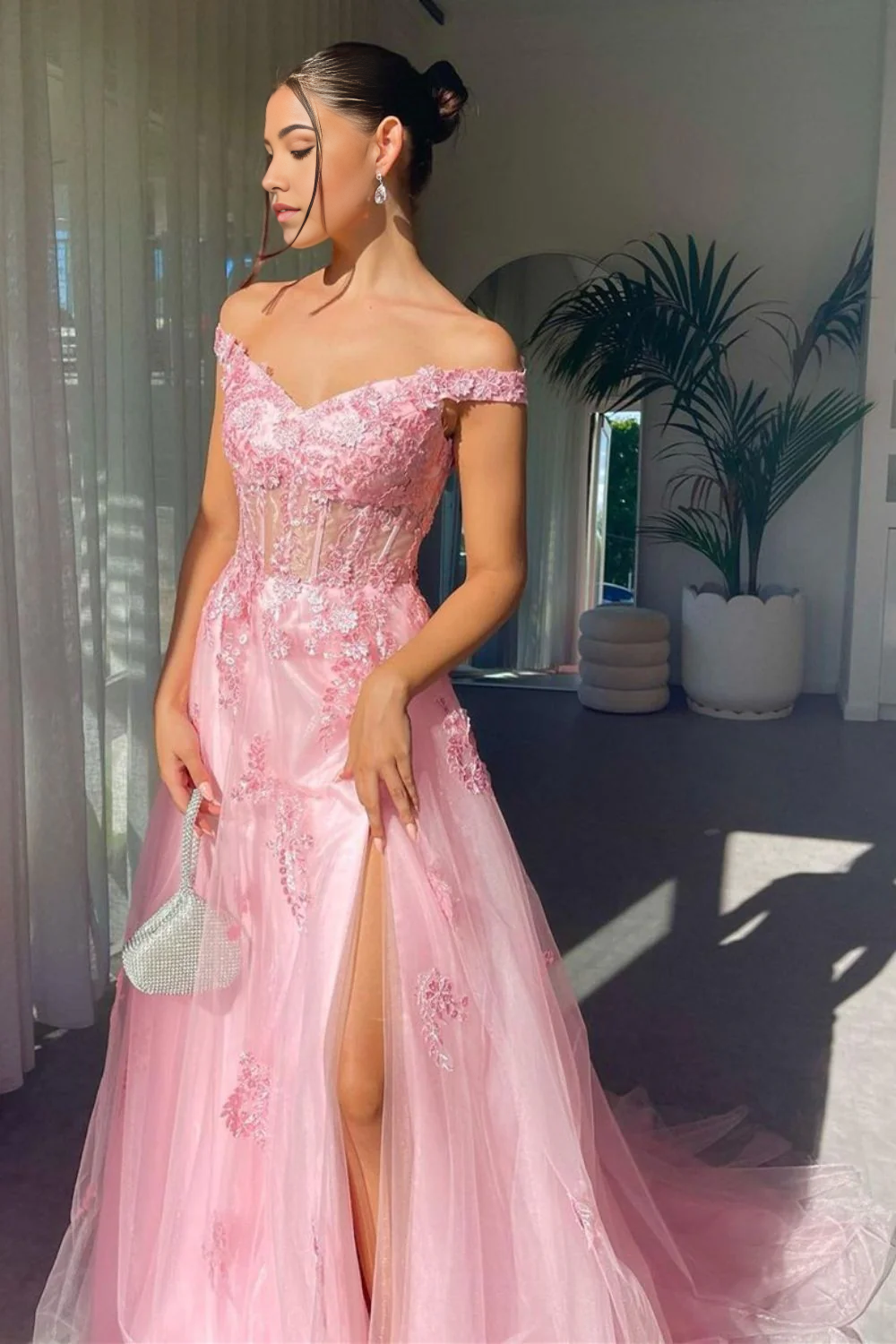 Elegant A-line off-shoulder pink prom dress with intricate appliques.