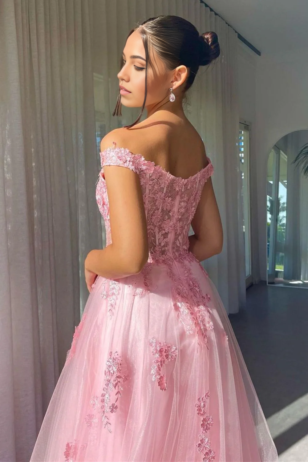 Side view of a charming pink A-line prom dress with off-shoulder design and appliques.