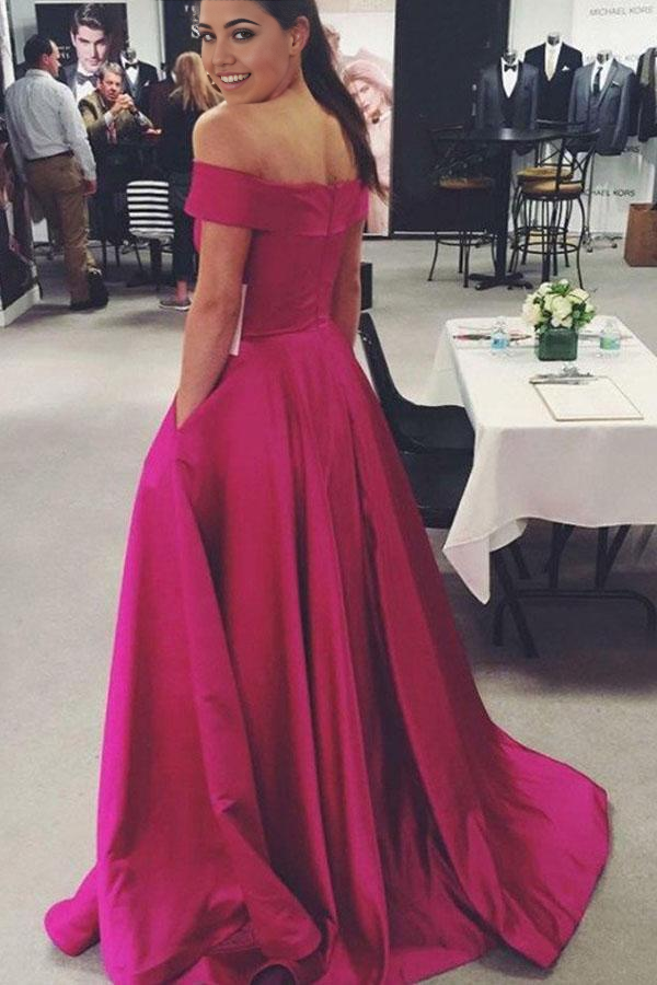 Side view of pink satin off-the-shoulder prom dress.