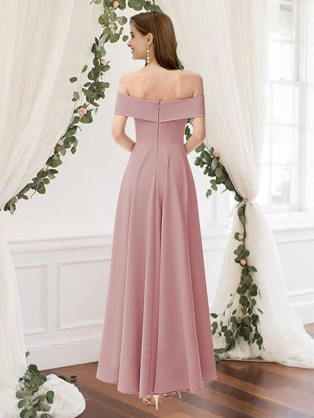 Back view of a flowing floor-length chiffon bridesmaid gown with delicate pleats.