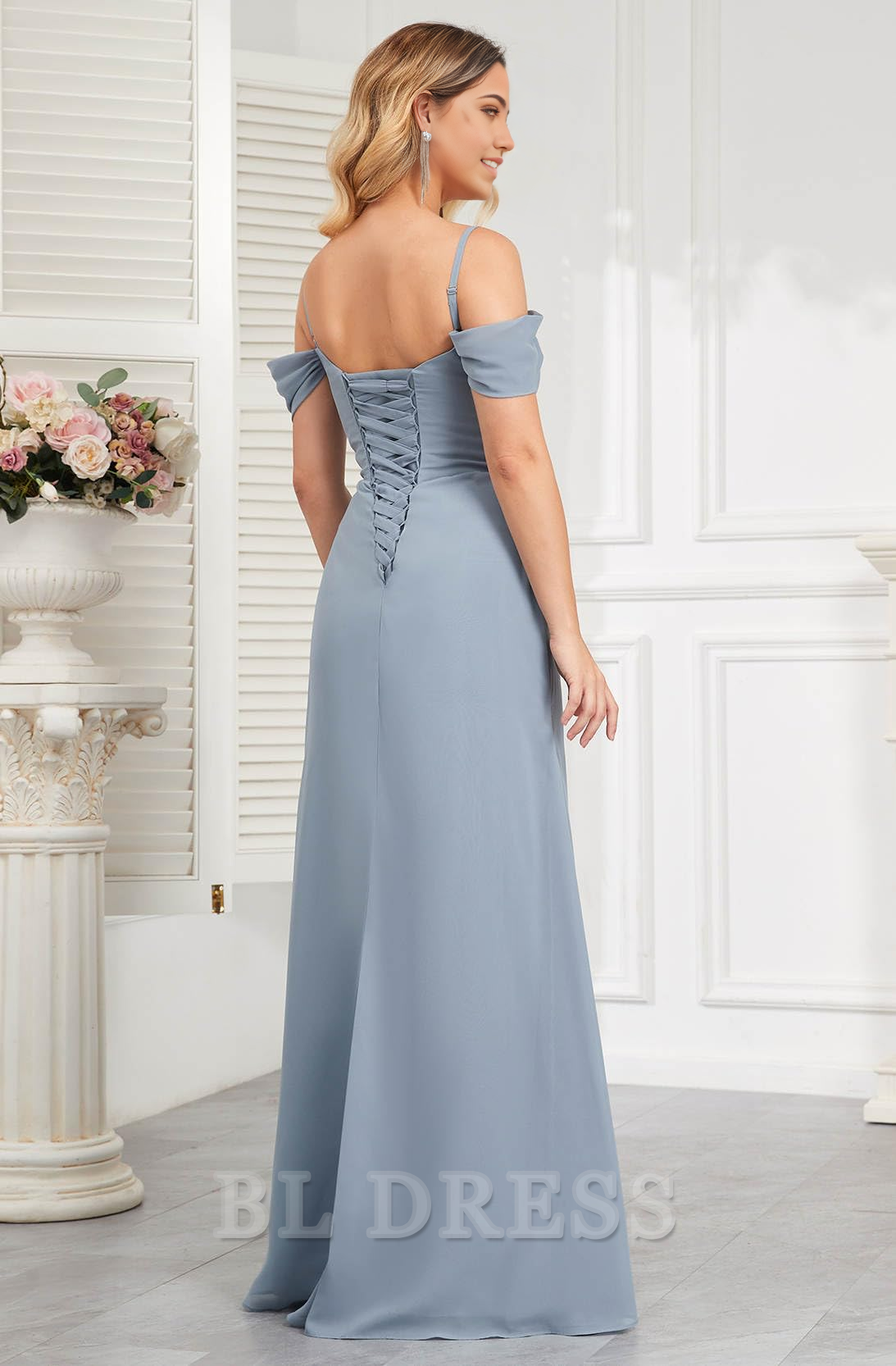 Back view of an A-Line off-shoulder pleated chiffon long formal gown.