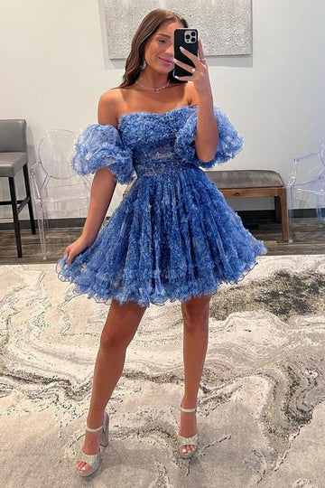 Side profile of a model in the ruffled printed homecoming dress.