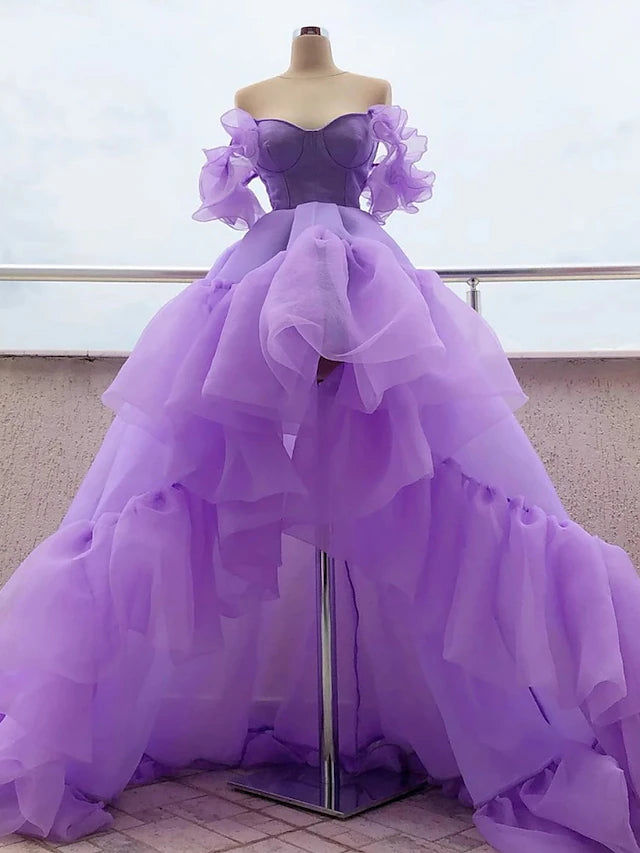 Purple A-line high-low prom dress with off-shoulder neckline and tiered tulle skirt.