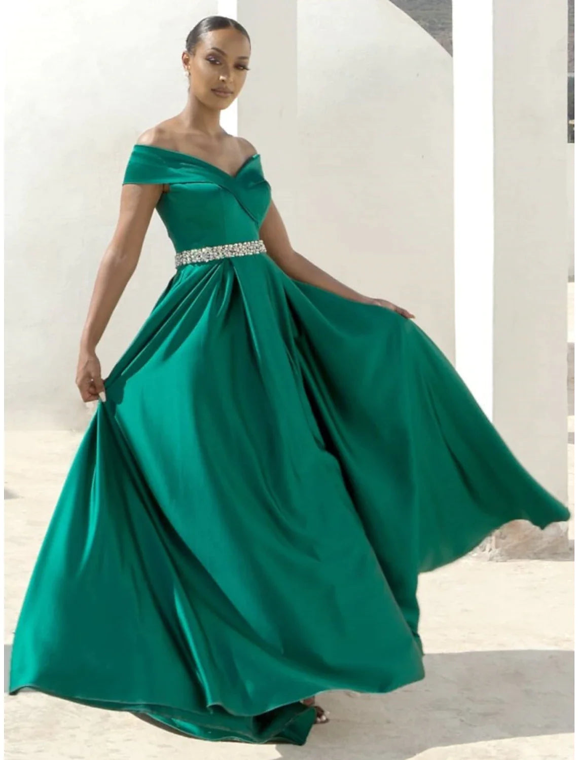 Elegant A-line off-shoulder red evening gown with pleats and crystals.