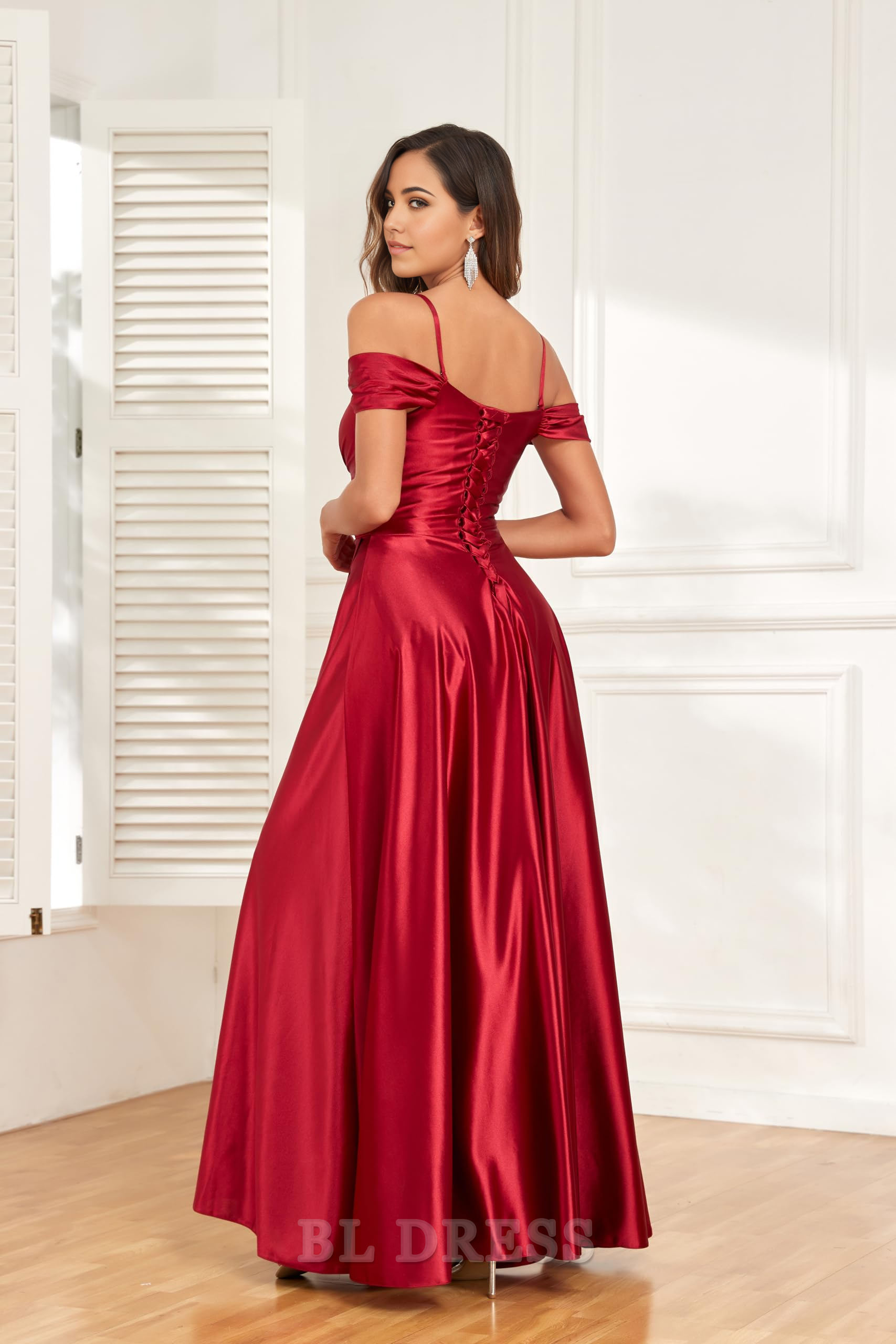 Side view of the long A-line satin dress, highlighting the off-shoulder neckline and leg slit.