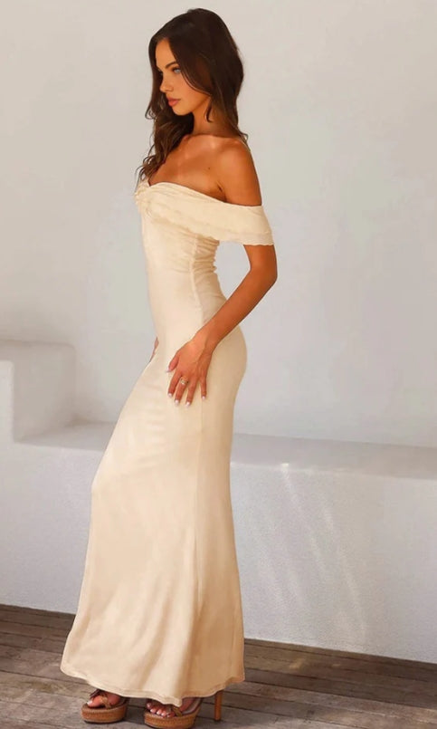Side view of the ankle-length satin dress, highlighting the silhouette.