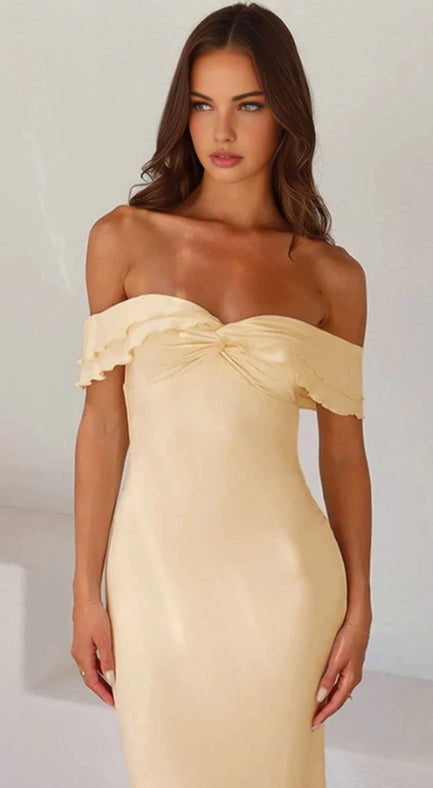 Close-up of the ruffle and satin fabric on the off-shoulder dress.