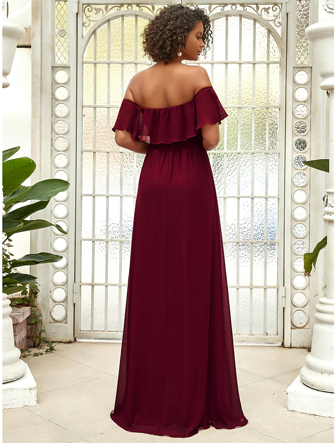 Close-up of the draped off-shoulder neckline and chiffon fabric details.