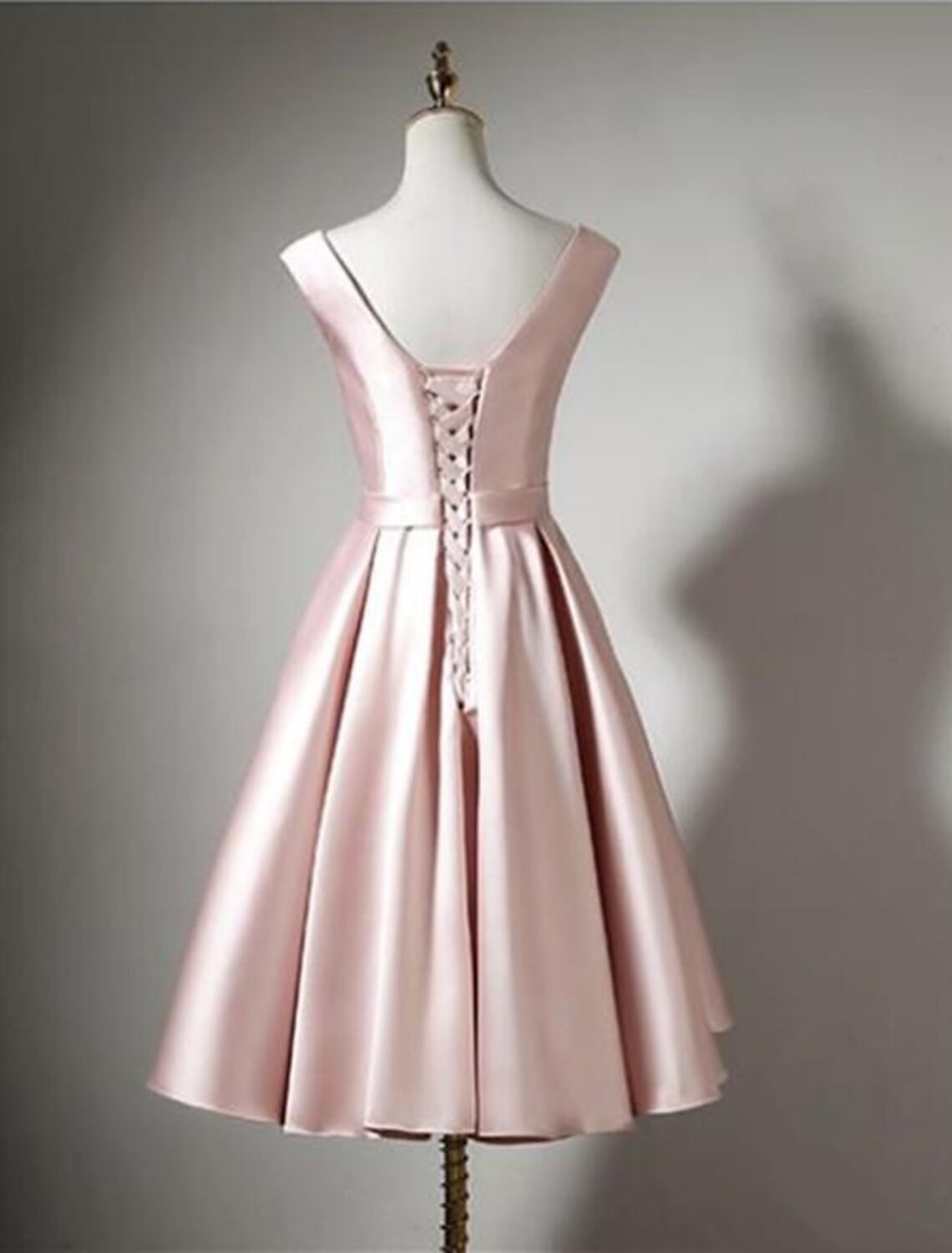 Back view of sleeveless off-shoulder formal dress.