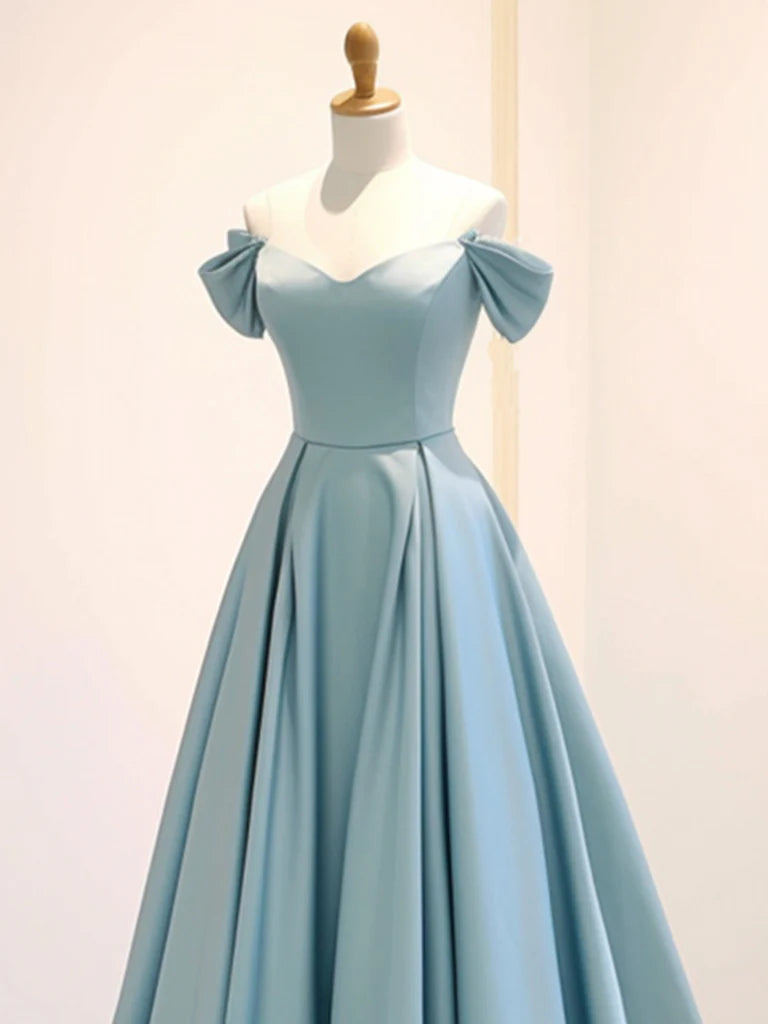 Back view of a woman wearing the navy blue A-line off-shoulder formal gown.