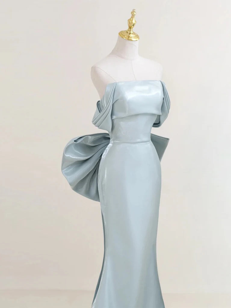 Side view of the flowing satin long prom dress with off-shoulder neckline.