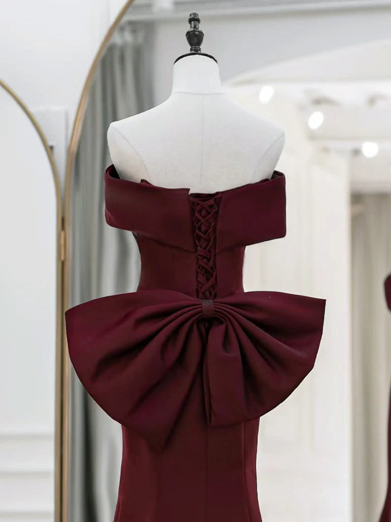 Side view of the elegant off-shoulder satin gown.