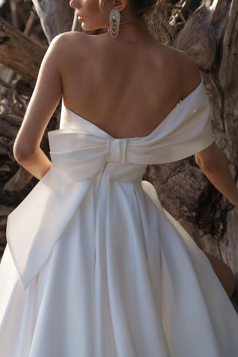Full length view of the satin pleated wedding dress.