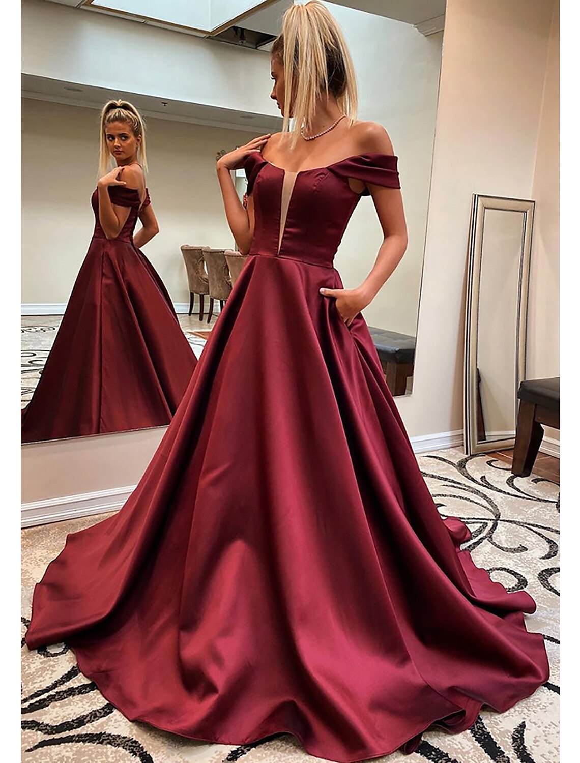 Elegant A-line off-shoulder satin prom dress with pockets and sweep train.