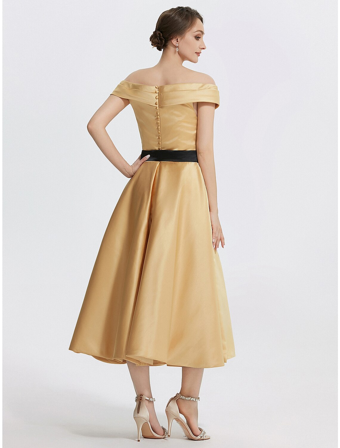 Back view of the A-line off-shoulder satin tea length dress.