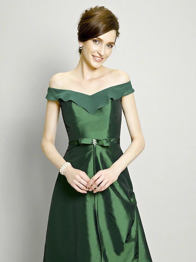 Back view of the A-line dress showcasing the pick-up skirt and beading details.