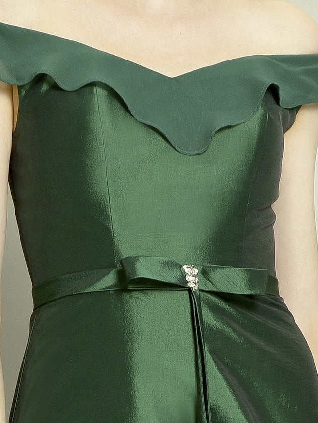 Close-up of the off-shoulder neckline and short sleeve on the elegant gown.