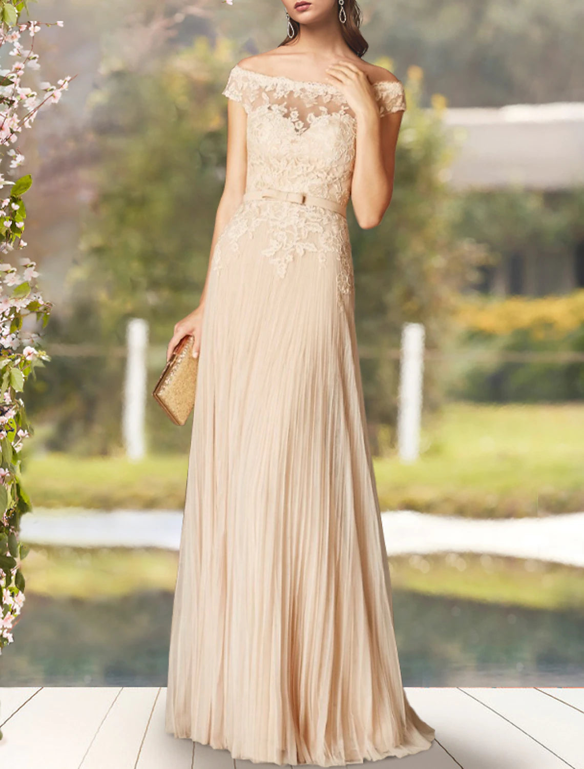 Close-up of the lace appliques and short sleeves on the off-shoulder Mother of the Bride dress.