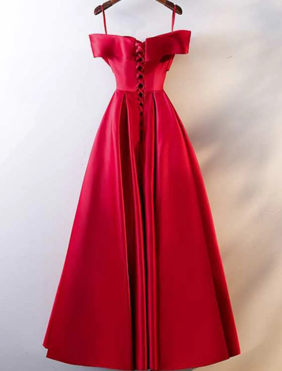 Side view of the A-line off-shoulder short sleeve ruched satin floor-length prom dress, showing the open back.