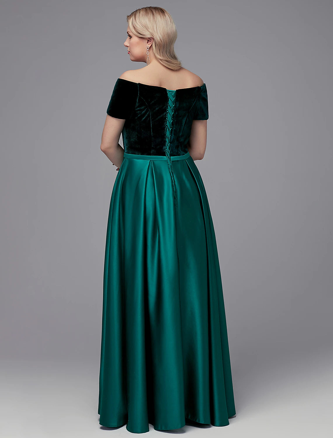 Side view of the elegant floor-length satin dress.
