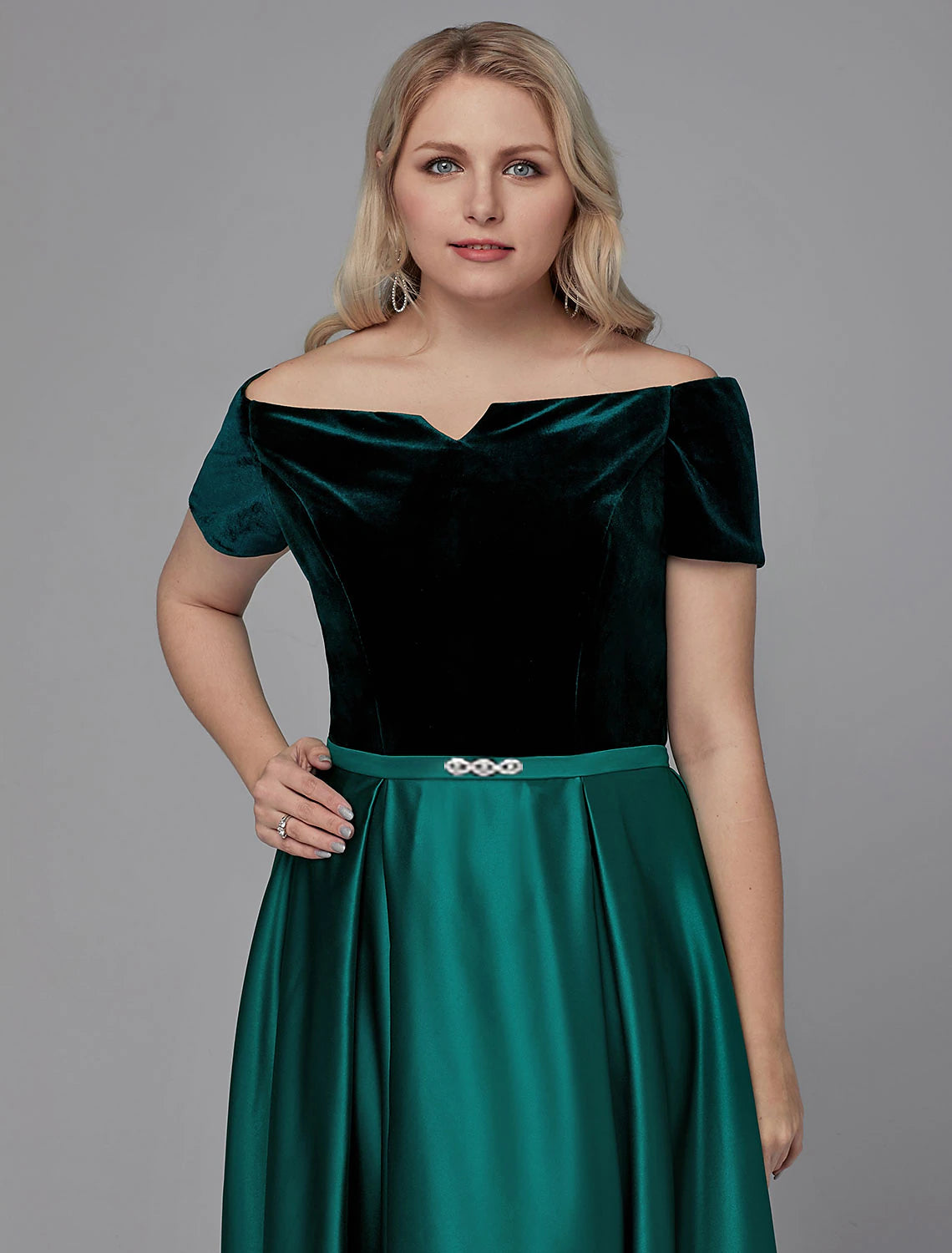 Close-up of crystal embellishments on the satin dress.