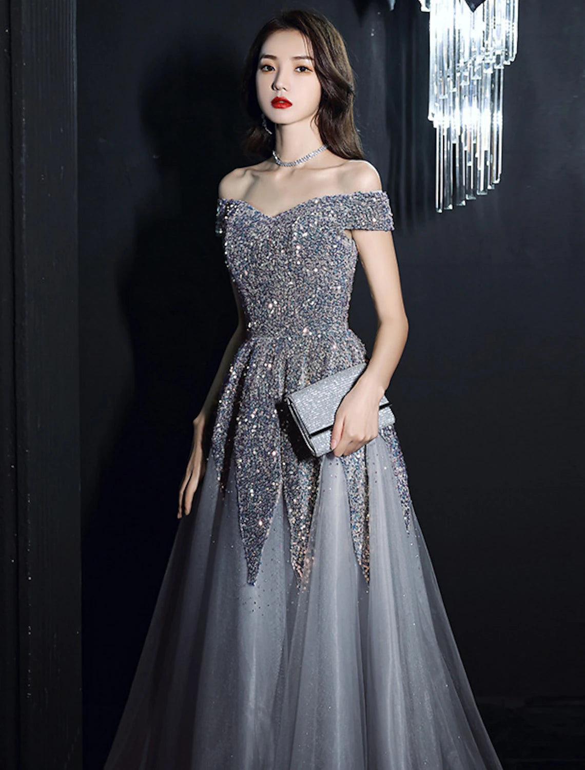 Elegant A-Line prom dress with off-shoulder neckline and sequin details.