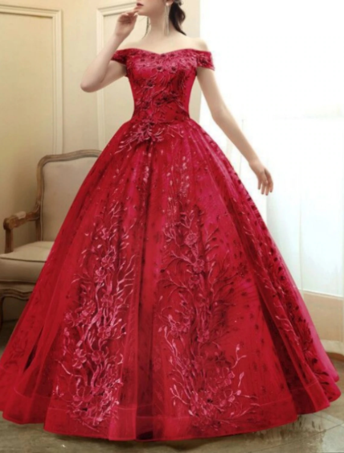 Back view of A-line off-shoulder short sleeve tulle formal gown.