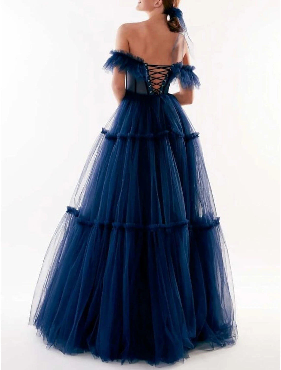 Close-up of the off-shoulder neckline and short sleeves of the tulle dress.