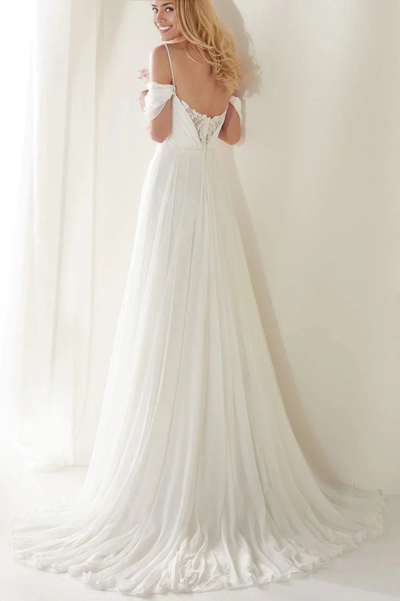 Back view of an A-line bridal gown featuring off-shoulder straps and a long sweep train.