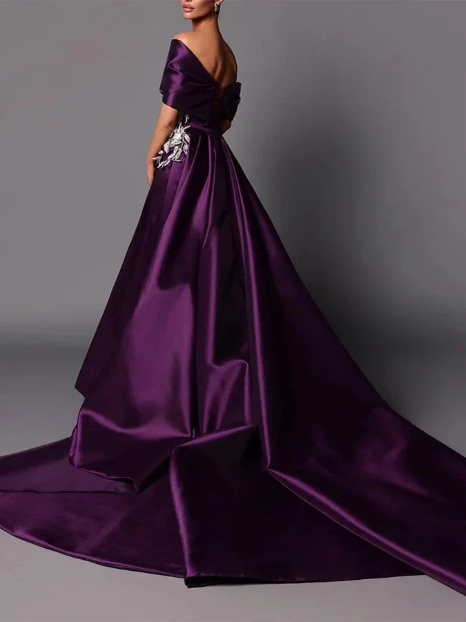 A-line off-shoulder formal dress with a long sweep train, side view.