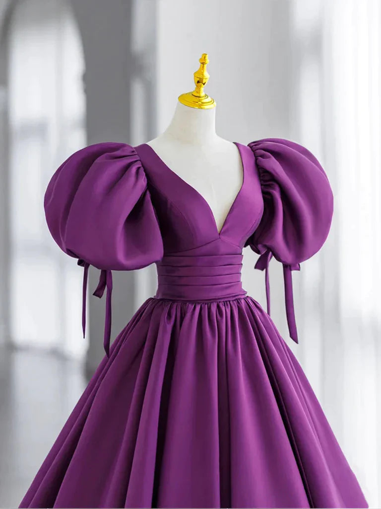 Close-up of the off-shoulder sweetheart neckline on the satin prom dress.