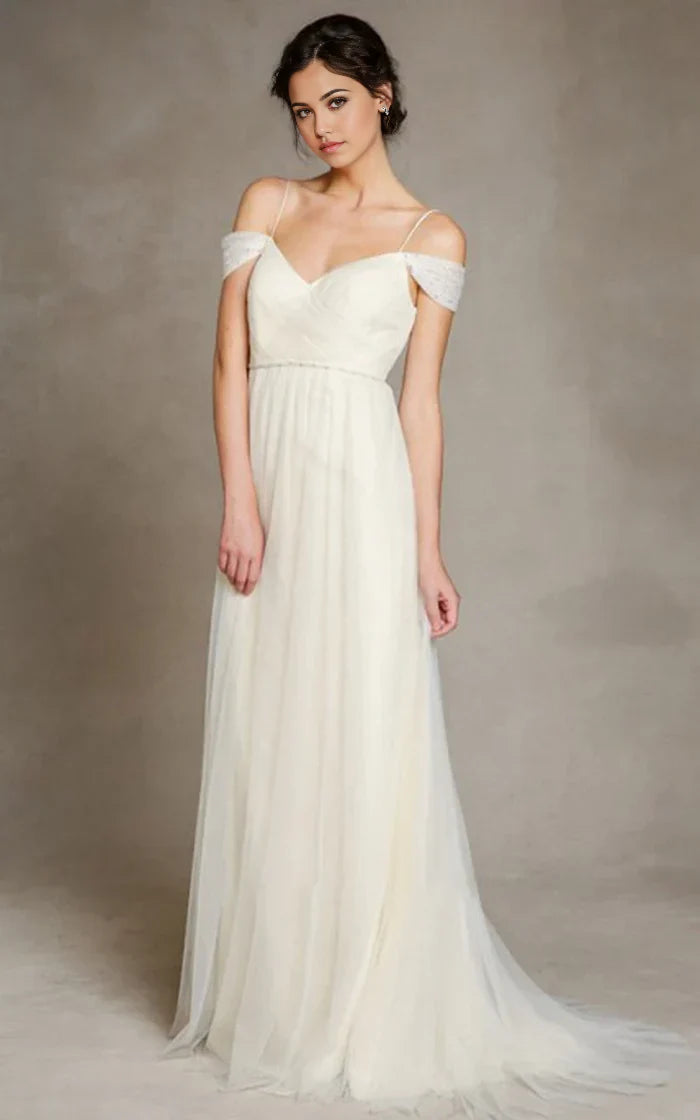 Elegant A-line off-shoulder tulle wedding dress with spaghetti straps.