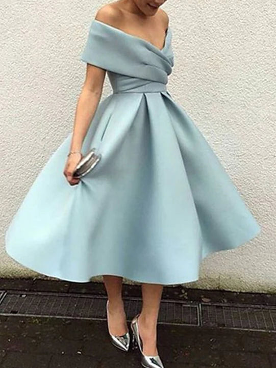 Elegant A-Line off-shoulder tea length prom dress on a model.