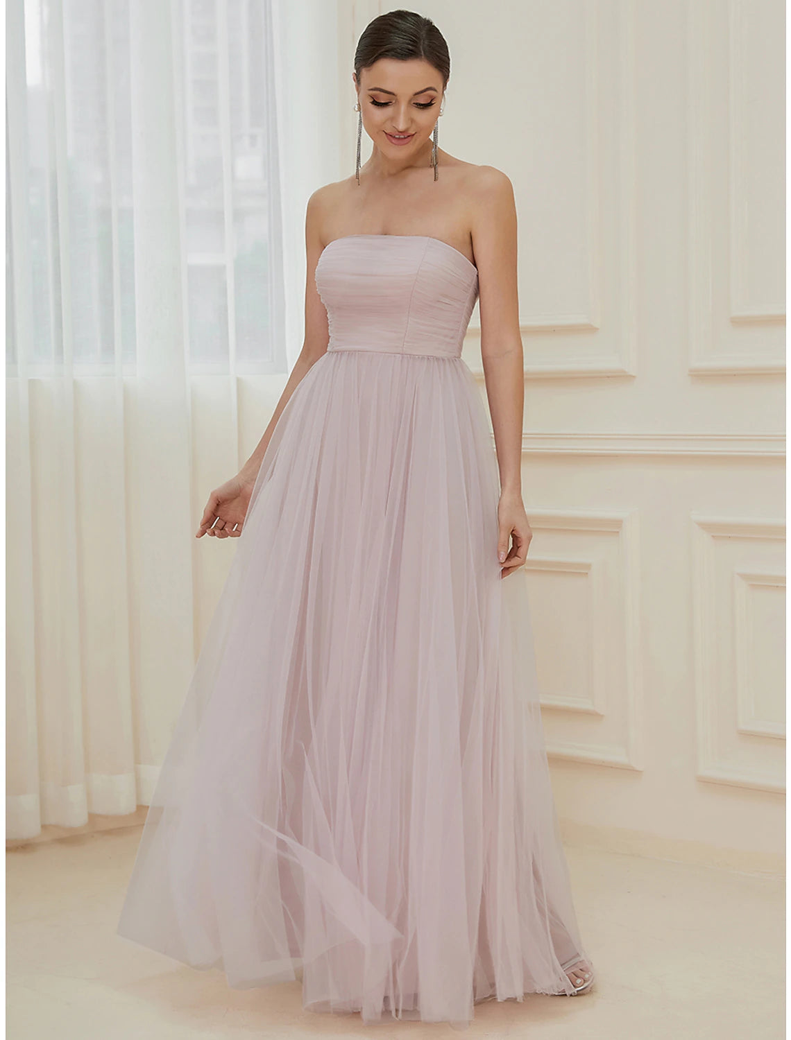 Back view of tiered tulle floor-length gown.